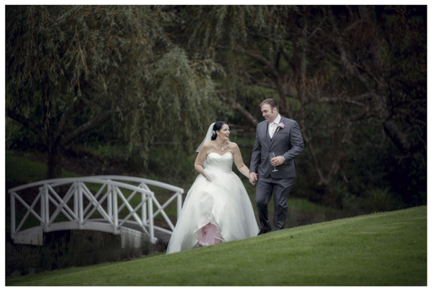 Bride and groom pose on Romeo and Juliet bridge.