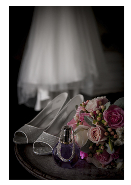 colourful Bridal floral bouquet photo with wedding dress and shoes.