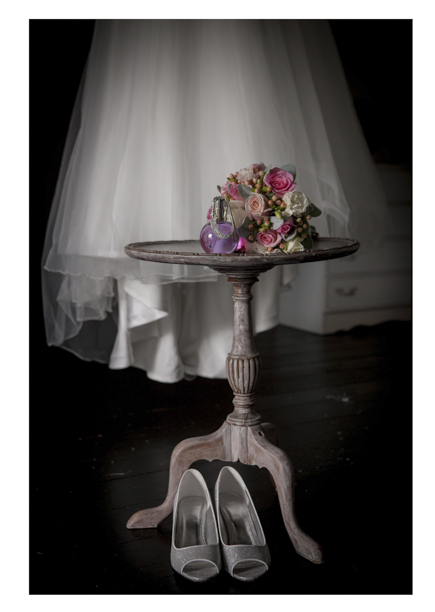 colourful Bridal floral bouquet photo with wedding dress and shoes.