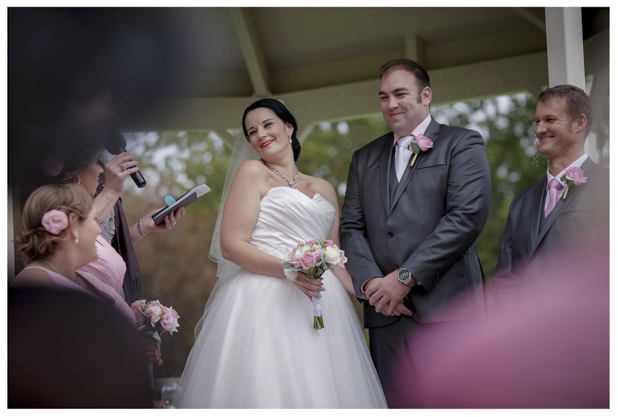 Bride and groom laugh joyfully during wedding ceremony at Gracehill Vineyard Estate