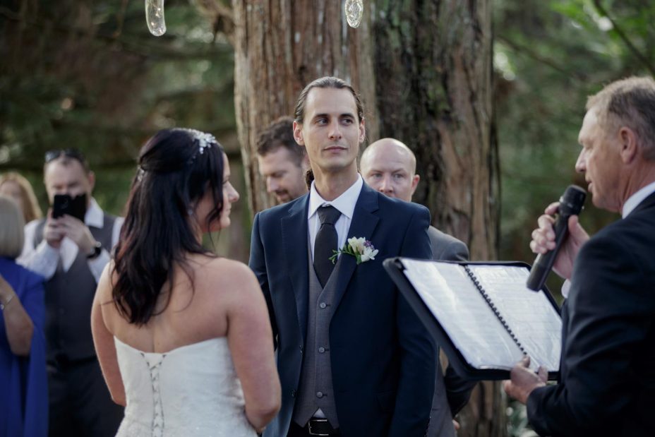 Bride and groom make their wedding vows during ceremony at Kumeu Valley Estate