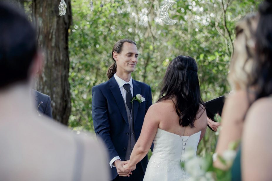 Bride and groom make their wedding vows during ceremony at Kumeu Valley Estate