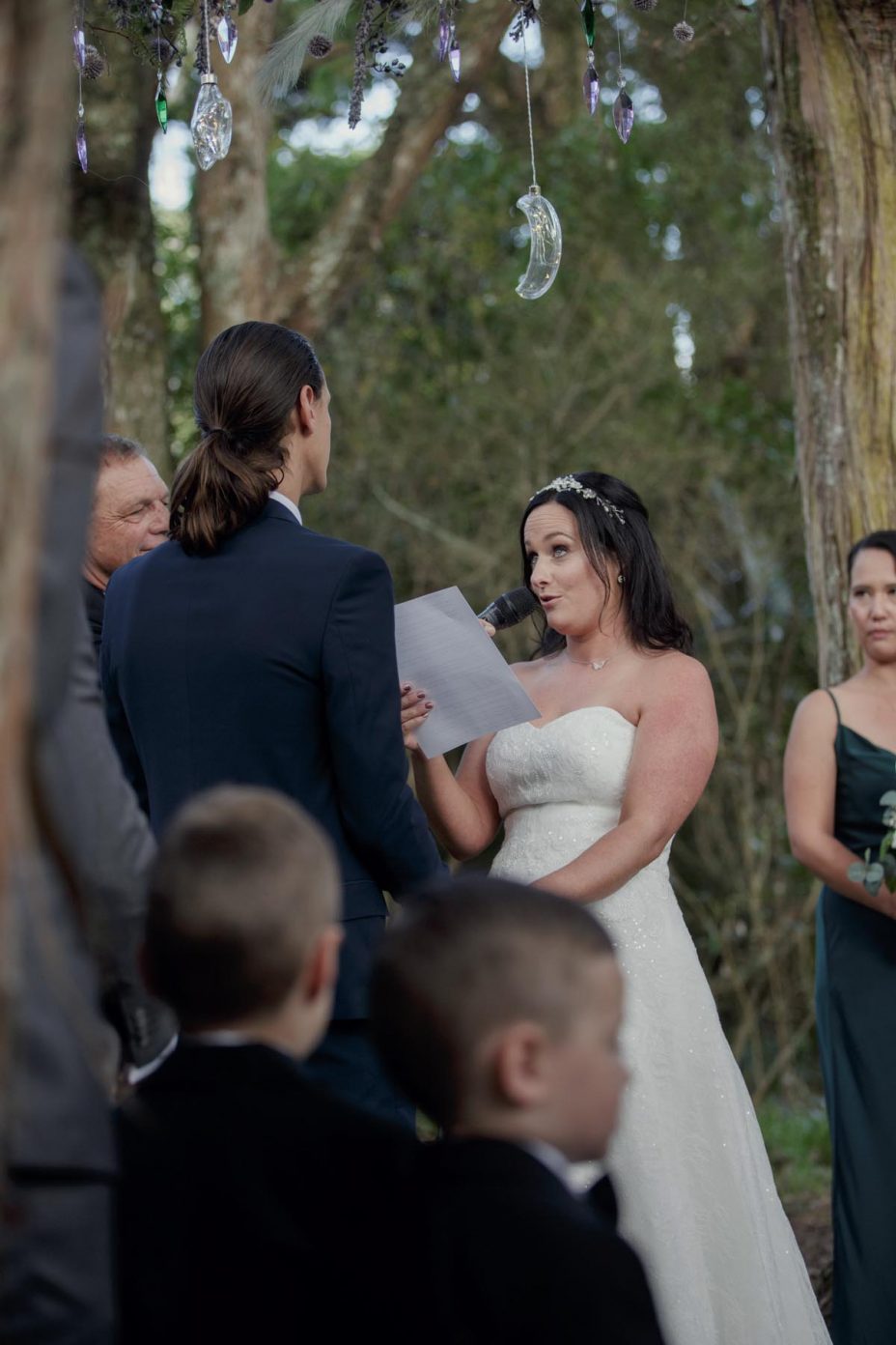 Bride and groom make their wedding vows during ceremony at Kumeu Valley Estate