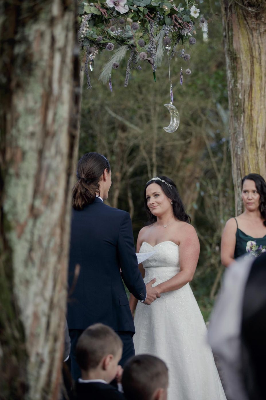 Bride and groom make their wedding vows during ceremony at Kumeu Valley Estate