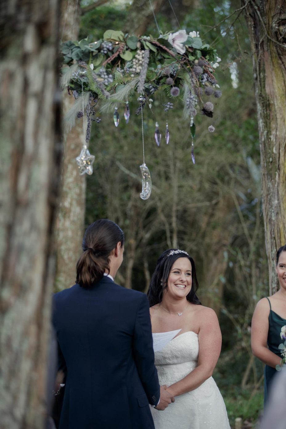 Bride and groom make their wedding vows during ceremony at Kumeu Valley Estate