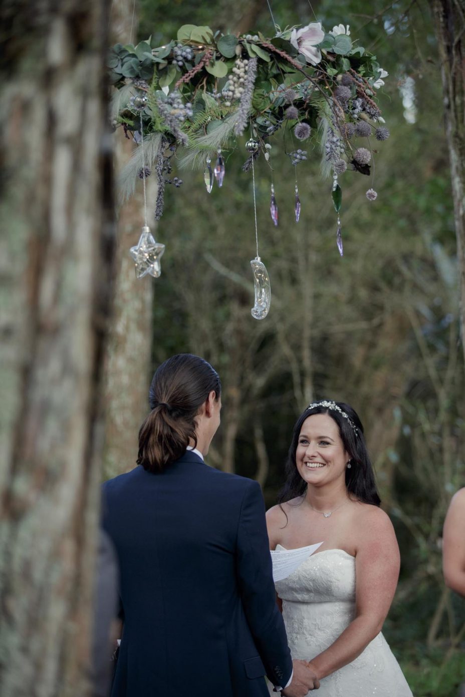 Bride and groom make their wedding vows during ceremony at Kumeu Valley Estate