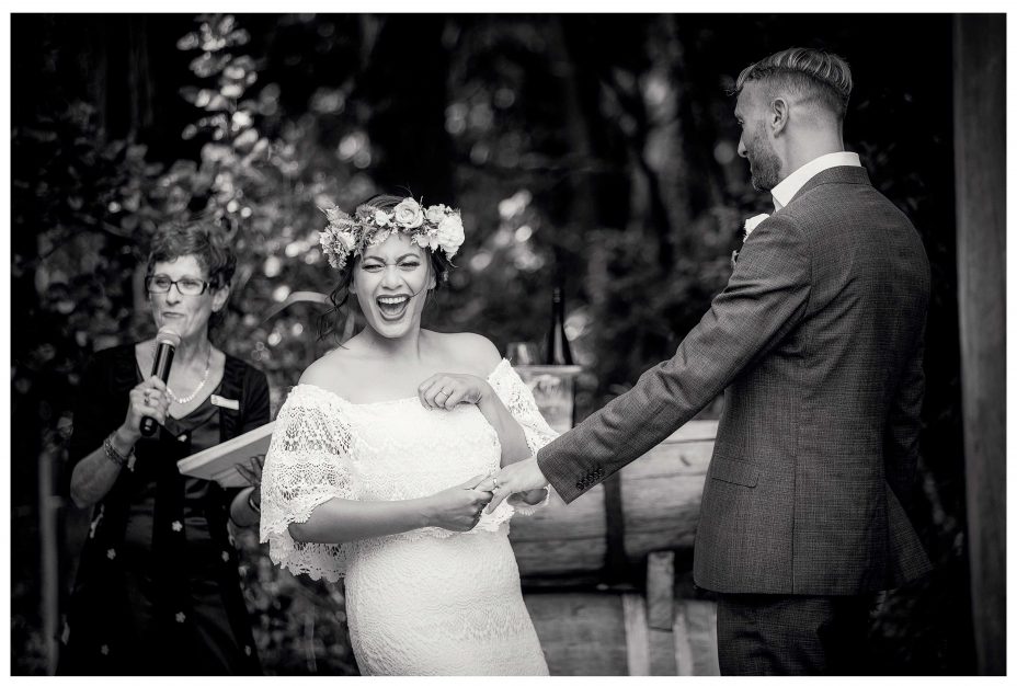 Wedding photo moment captured, Bride laughts at wedding ceremony , kumeu Valley Estate Wedding Ceremony